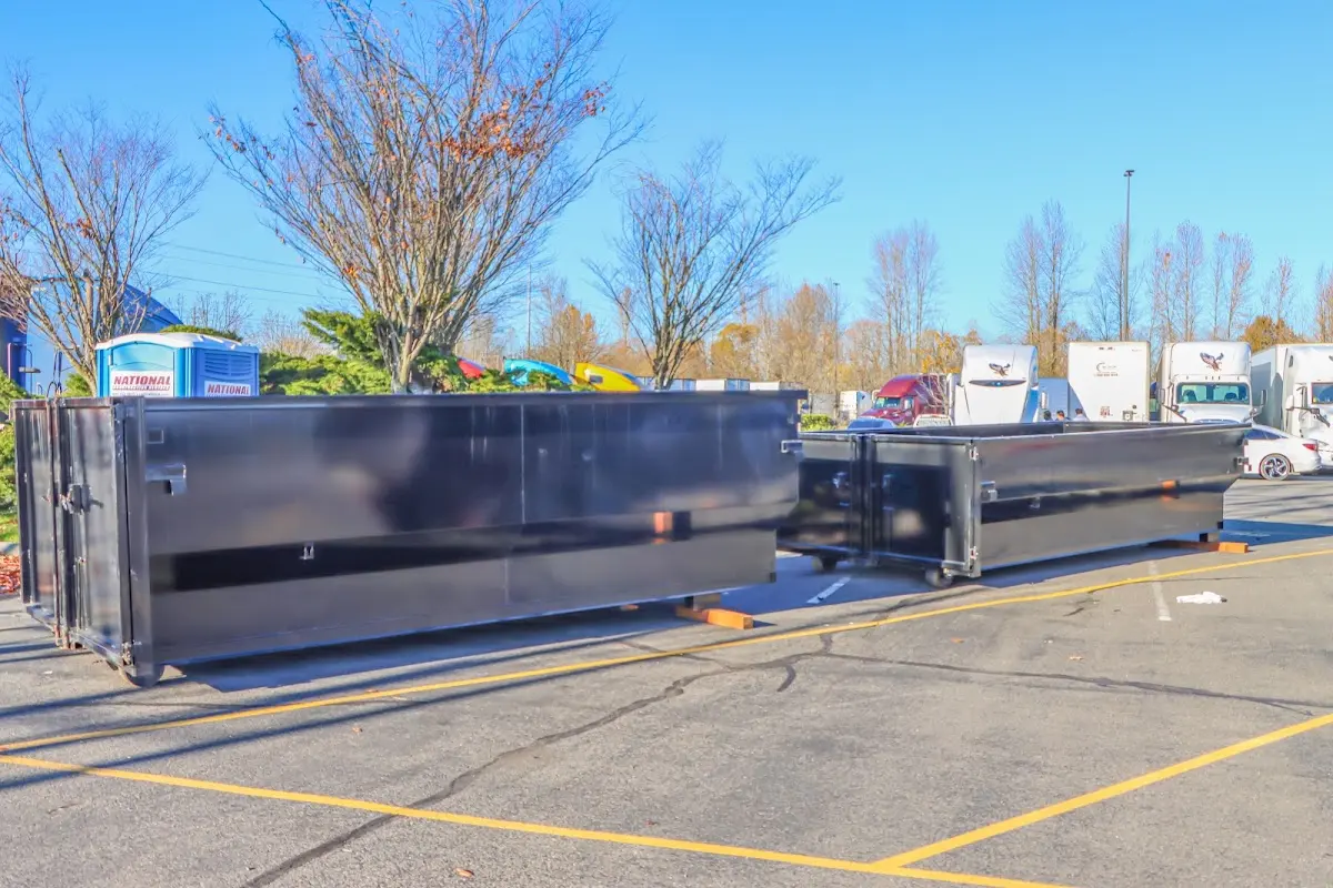 Professional dumpster rental service with roll-off container on residential driveway in Lake Norman of Catawba